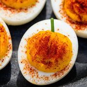 pumpkin deviled eggs with paprika and chives